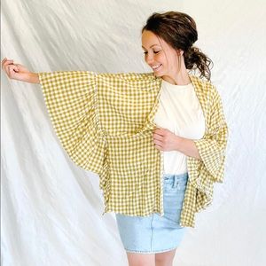 Easel yellow gingham cardigan with swooping ruffle sleeves. 
Size S